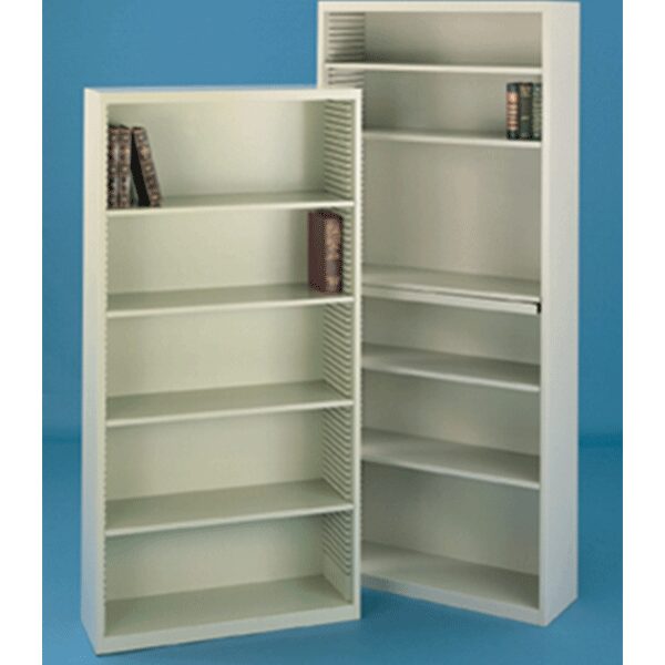 Tall white bookshelves with few books